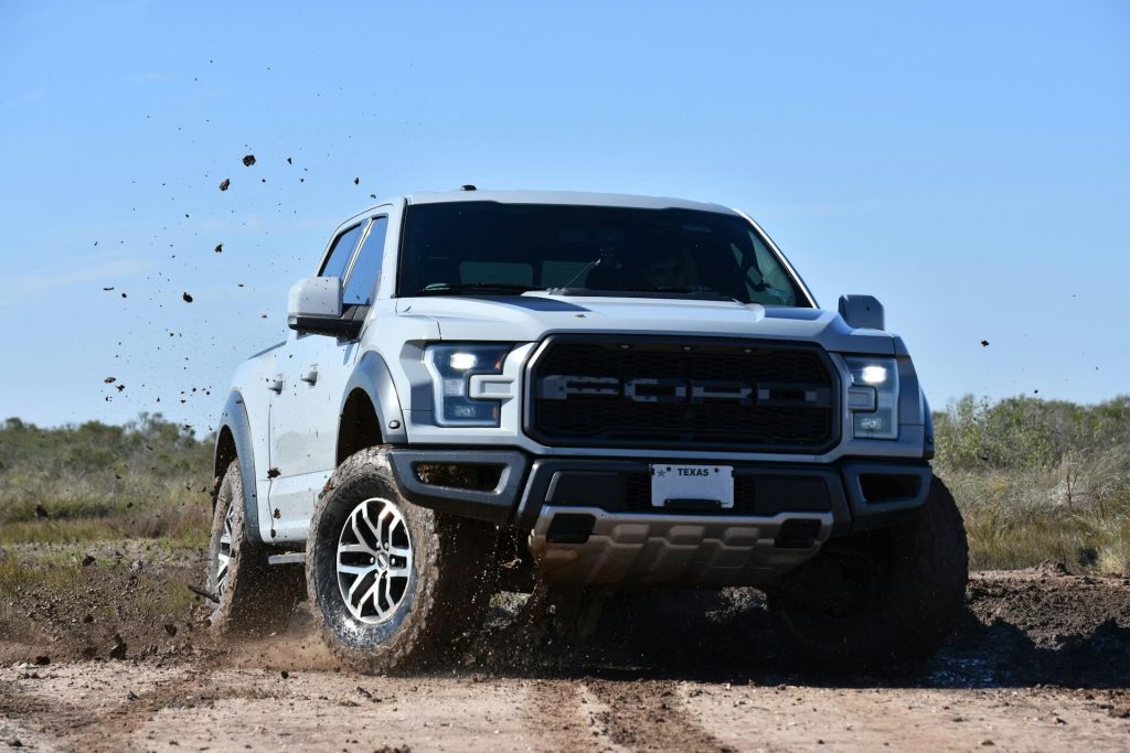 white ford raptor off roading
