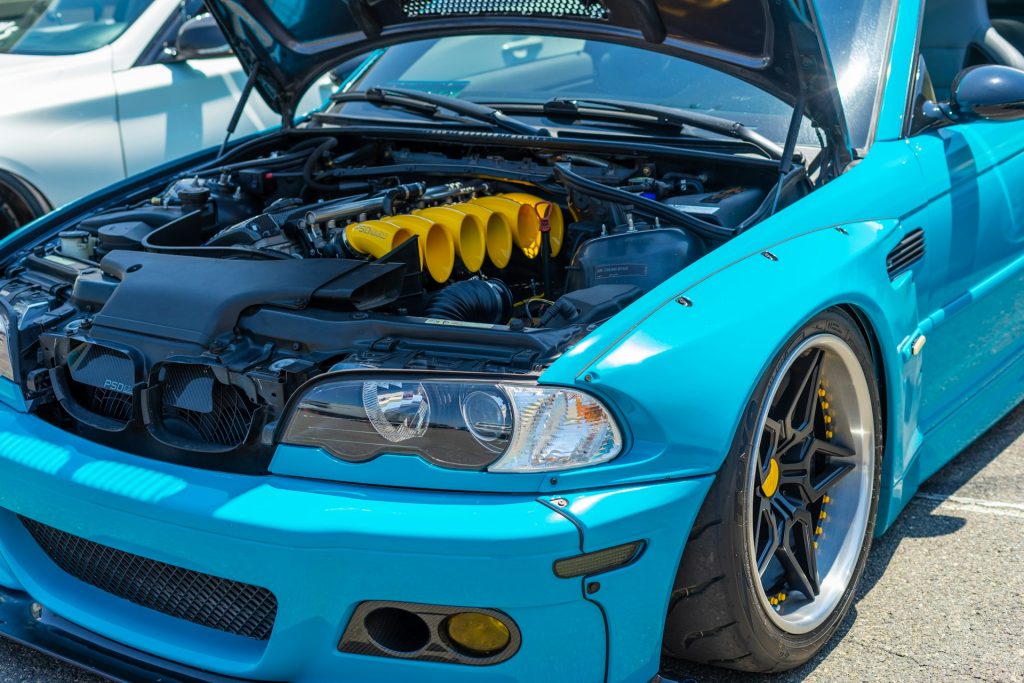 blue widebody bmw m3 engine bay